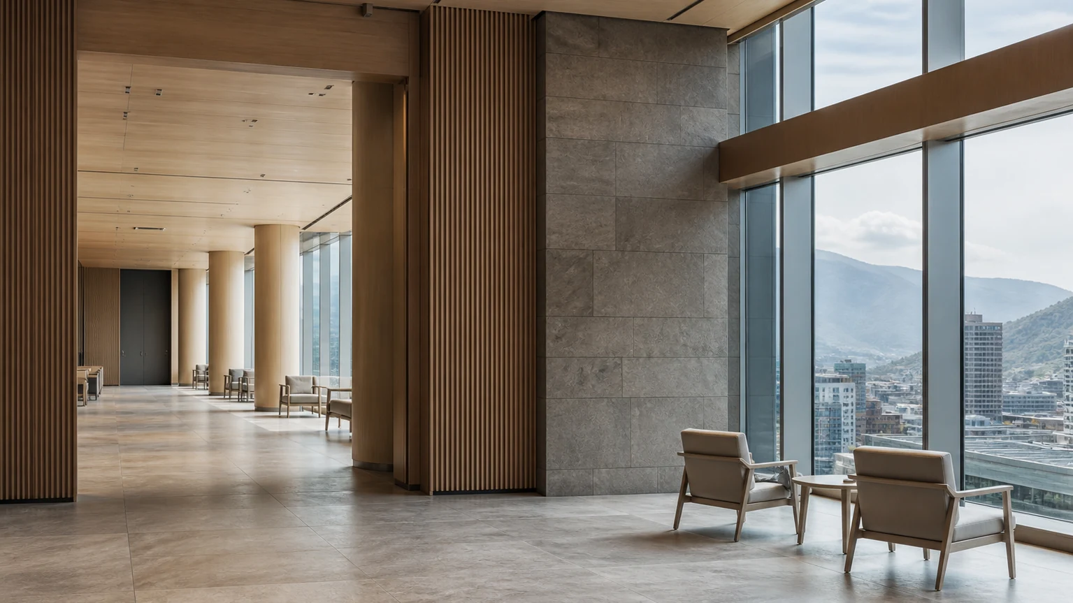 山並みとまちを望む現代的な公共施設のロビー